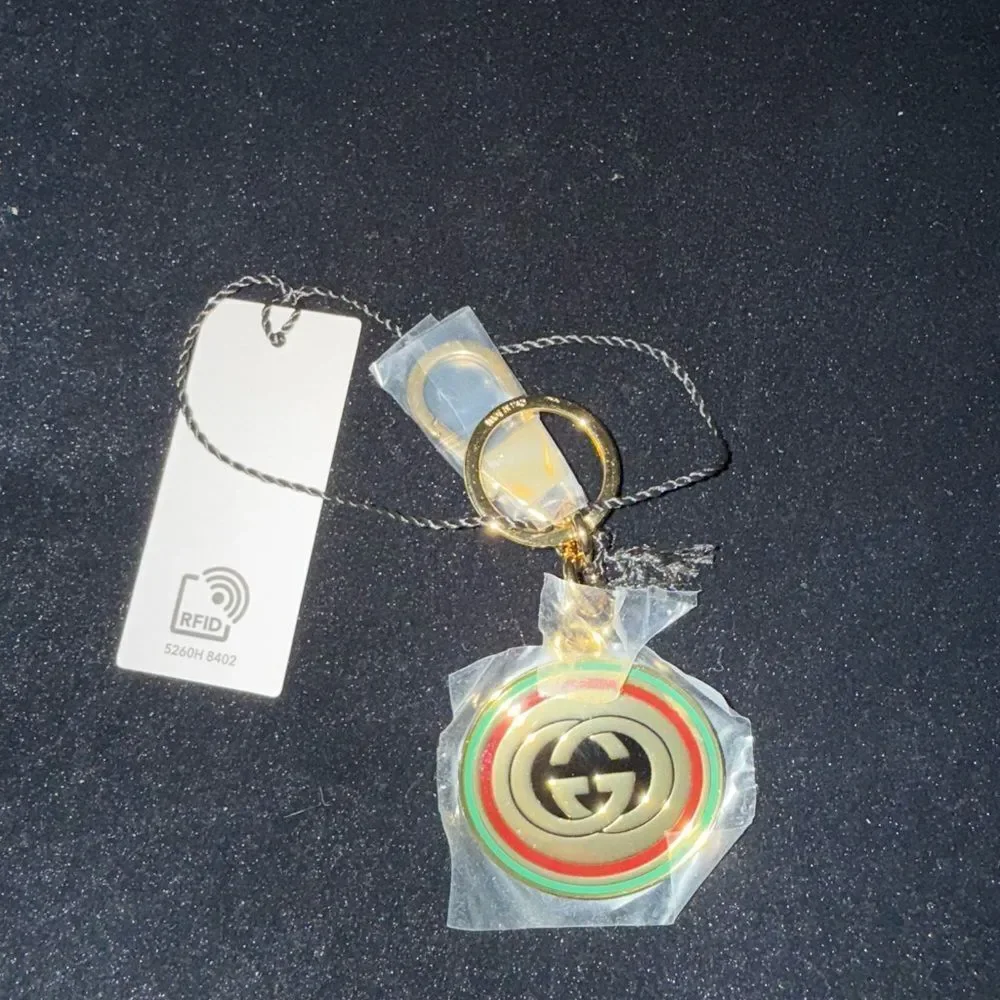 Brand new with box and dustbag Gucci Gold and Green Keychain